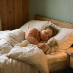 What to Say to Your Child the Night Before Daycare What to say the night before daycare - child sleeping peacefully with a stuffed toy at bedtime