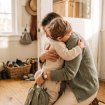 How long does separation anxiety last - parent hugging child goodbye at home entryway